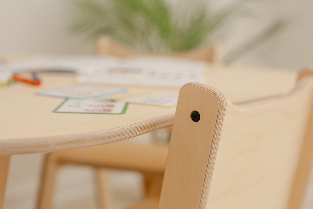 Close-up of Grow With Me wooden kids chair showing smooth rounded edges and Baltic birch finish