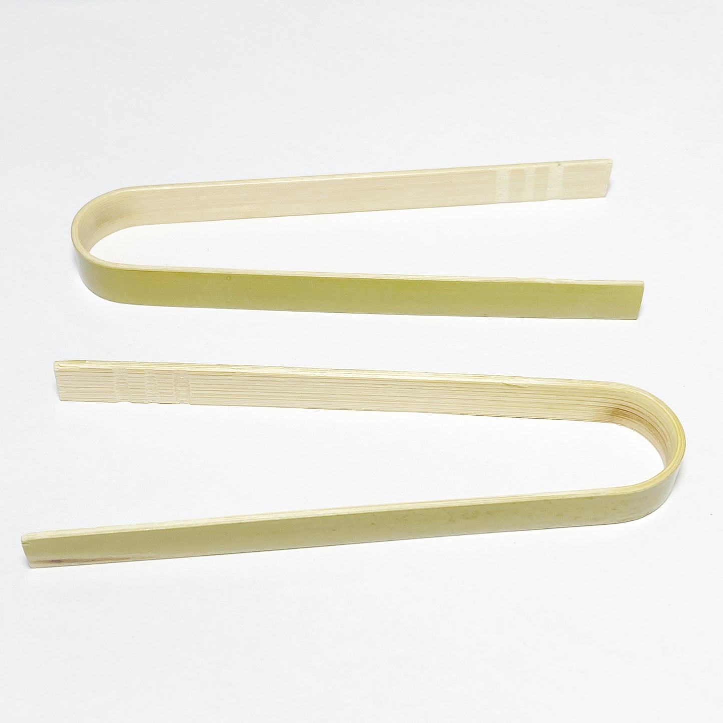 Two bamboo tongs for child’s play and fine motor development