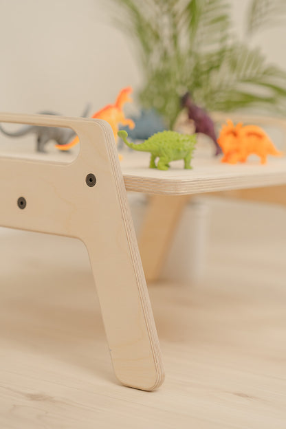 Close up product photo of small wooden kids table with a natural finish on baltic birch wood