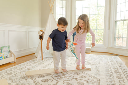 Blueberry and Third Wobble Beam providing vestibular and proprioceptive sensory input for toddlers, non-toxic solid wood children's balance toy, handcrafted in Ohio