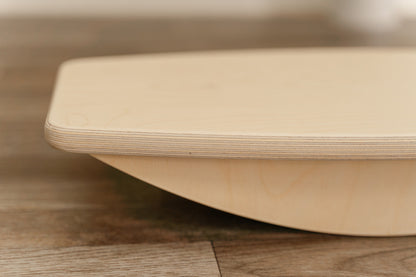 Blueberry and Third balance board in a calming corner setup, Montessori-inspired toddler furniture that supports focus and self-regulation