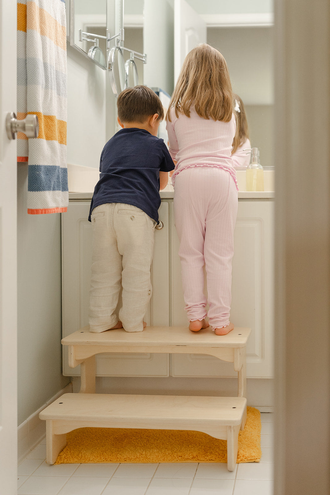 Blueberry and Third Double Step Stool positioned at kitchen counter as best alternative to learning tower for toddlers who have outgrown enclosed platforms