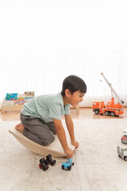 Blueberry and Third children's balance board supporting gross motor development and vestibular play, non-toxic solid wood, handcrafted in Ohio