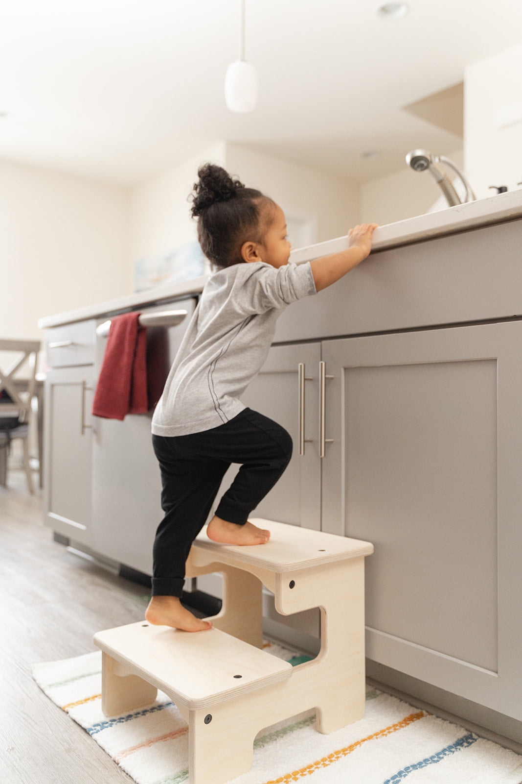 Blueberry and Third children's stepping stool in natural wood finish, lightweight and easy for toddlers to move independently around the home