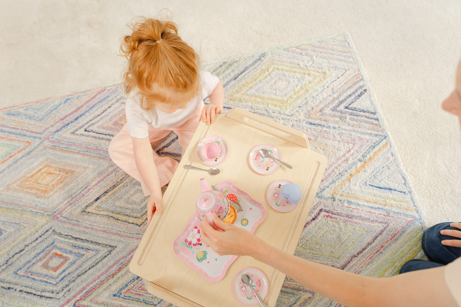 Blueberry and Third Play Tray kiddie table in family room, low floor seating setup for baby and toddler activities, games, and snack time together
