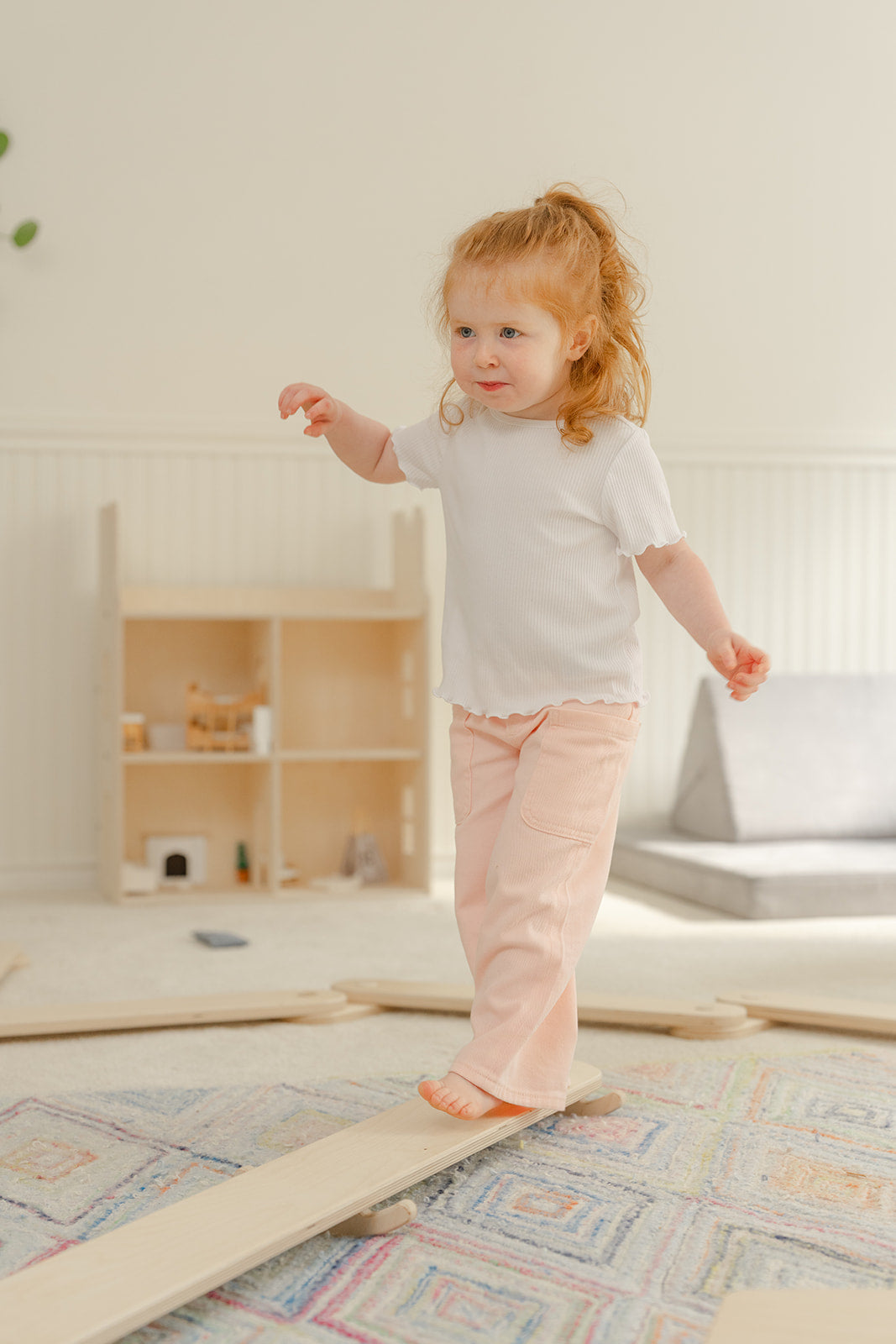 Blueberry and Third Wobble Beam in kids playroom furniture setup, Montessori-approved balance toy that supports focus, attention, and self-regulation in toddlers