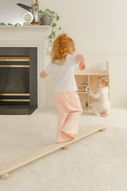 Blueberry and Third Wobble Beam in kids playroom furniture setup, Montessori-approved balance toy that supports focus, attention, and self-regulation in toddlers