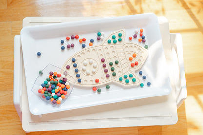 Educational rocketship-themed activity board with space design inspiring STEM learning and imaginative play. Montessori wooden sensory board combining creative theme with educational value encouraging preschoolers ages 3-6 to explore patterns colors and spatial concepts. Open-ended learning toy featuring engaging rocketship illustration fostering interest in science space exploration and problem-solving through tactile hands-on manipulation and creative pattern making activities.